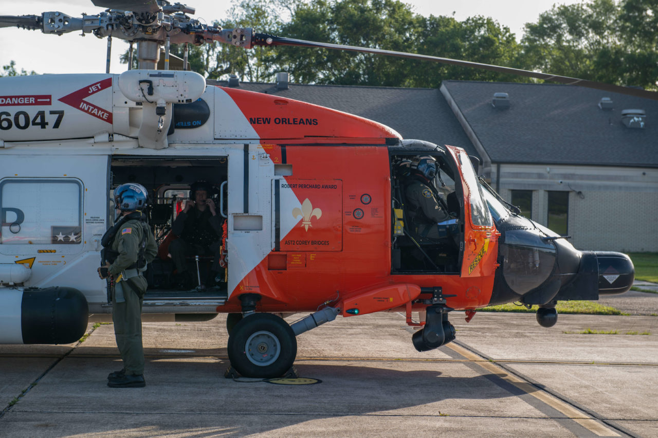 A Coast Guard MH-60T Jayhawk helicopter aircrew medevac man from deepwater construction vessel offshore Grand Isle